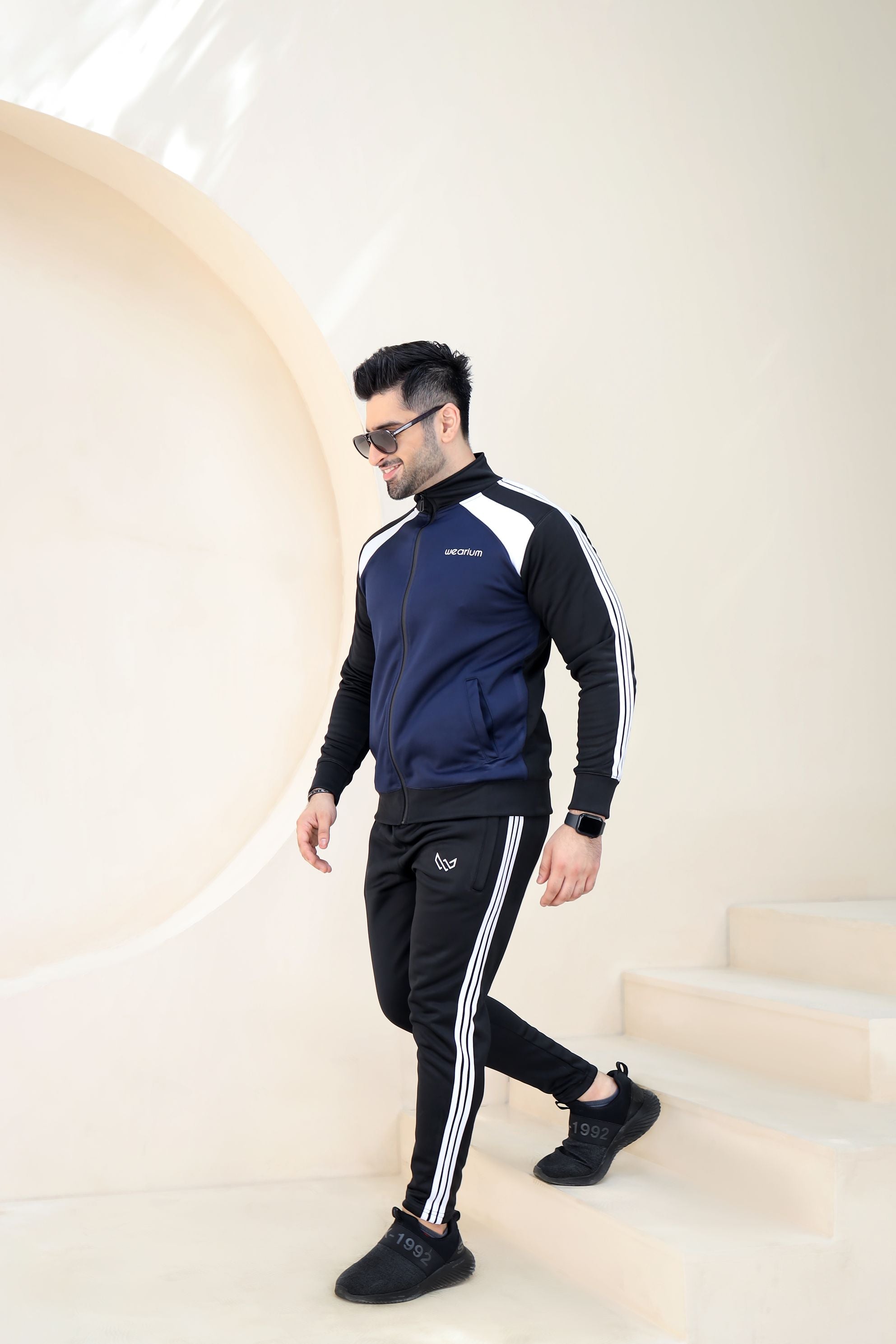 Black and blue tracksuit deals