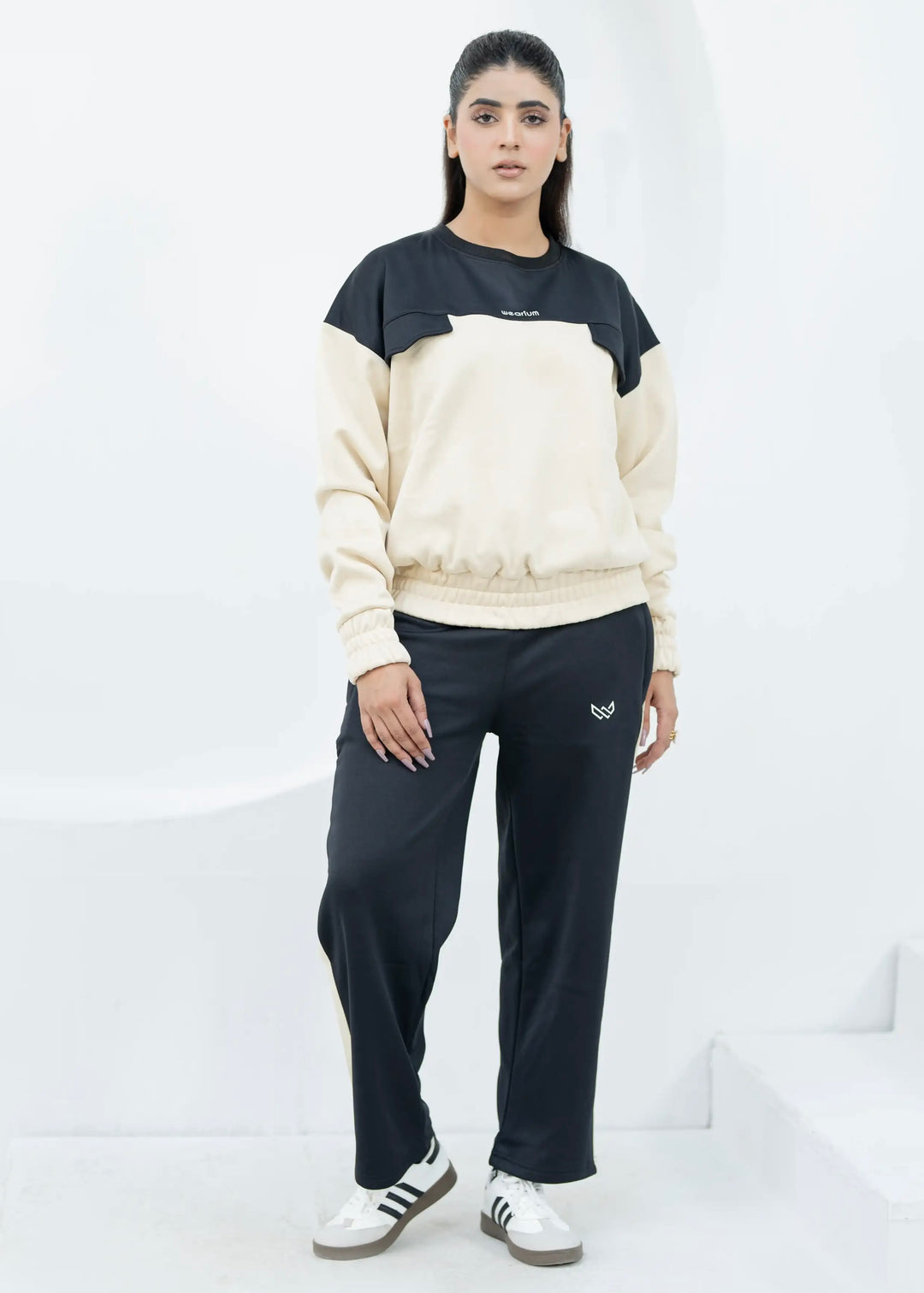 woman wearing a black and beige twinset for winter