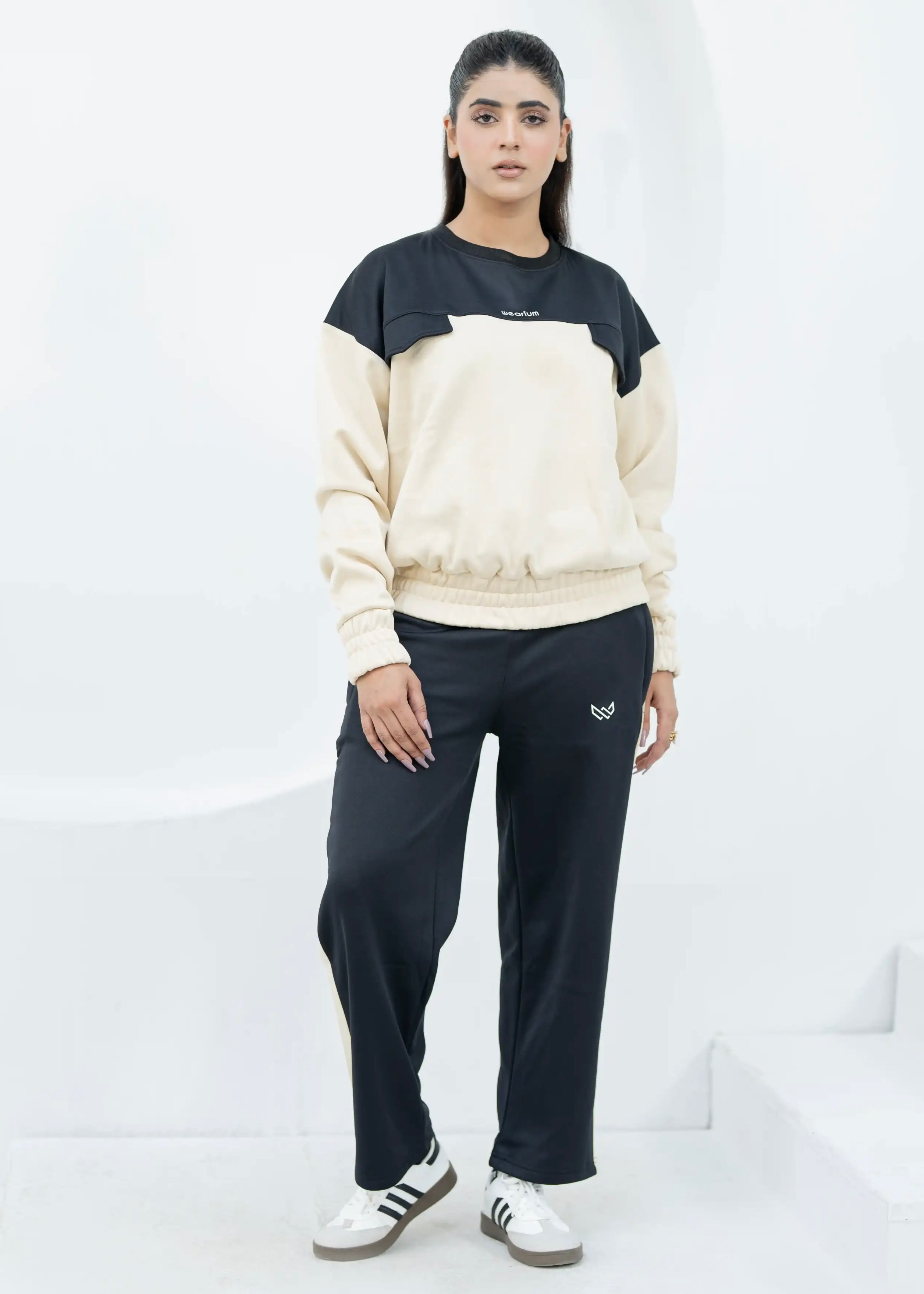 woman wearing a black and beige twinset for winter